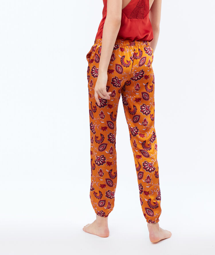Pantalon satin resserré aux chevilles ocre.