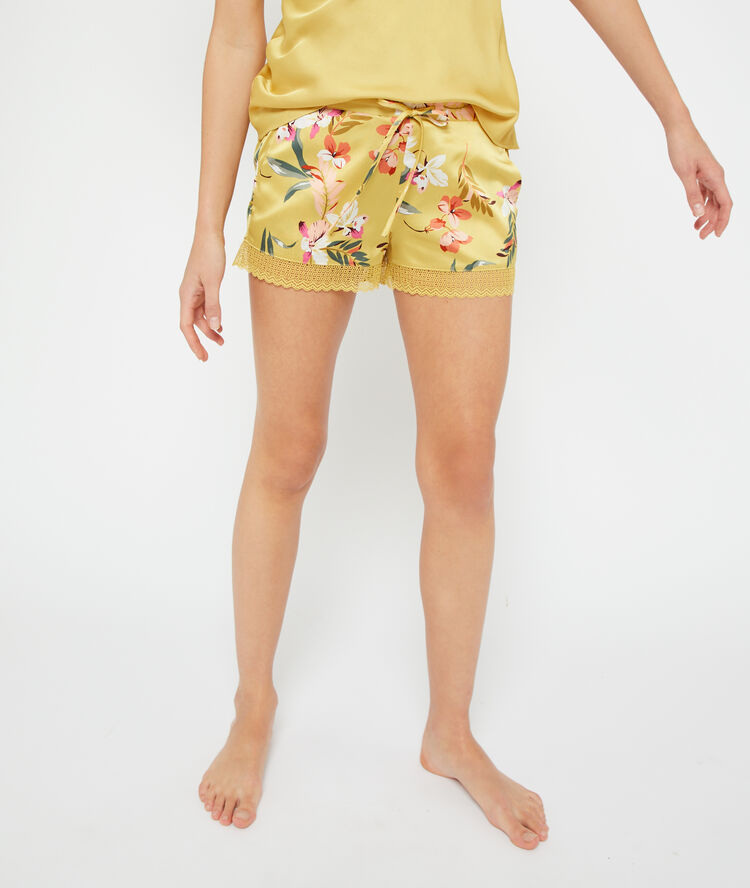 Gesatineerde shorts met bloemen felgeel.