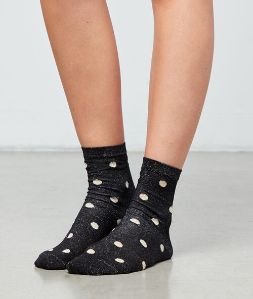 Chaussettes &agrave; pois noir.