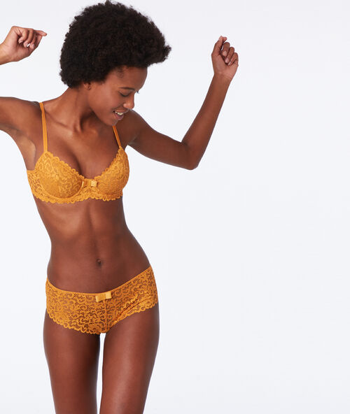 Soutien-gorge corbeille en dentelle moutarde.