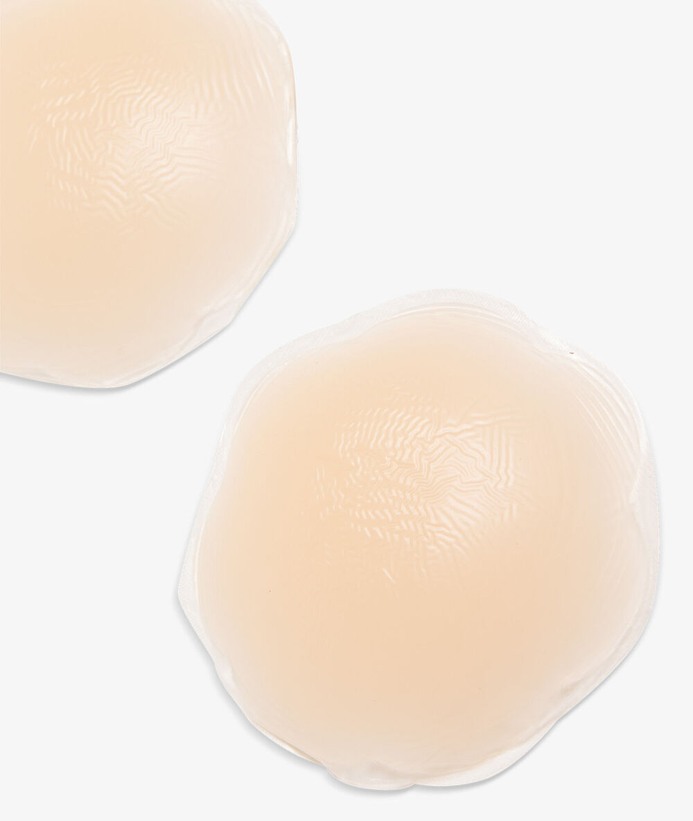 Cache tétons beige.