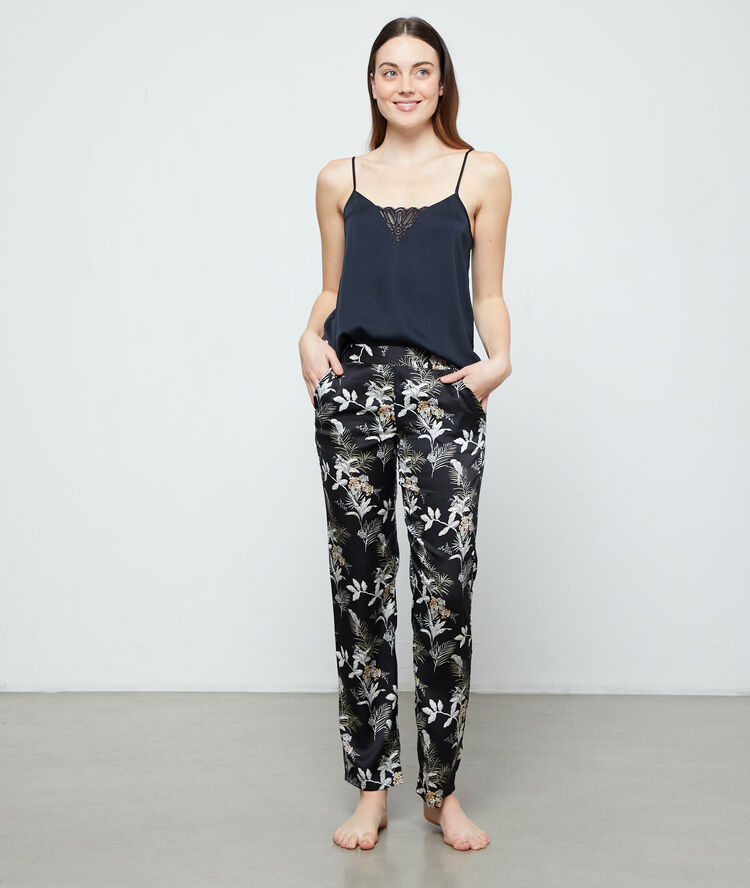 Pantalon imprimé feuillage noir.