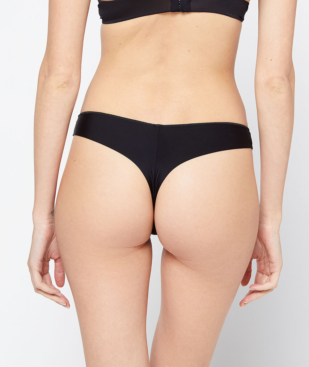 Tanga bi-matière noir.