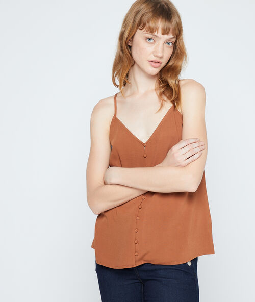 Top met knopen en bretellen savanna.