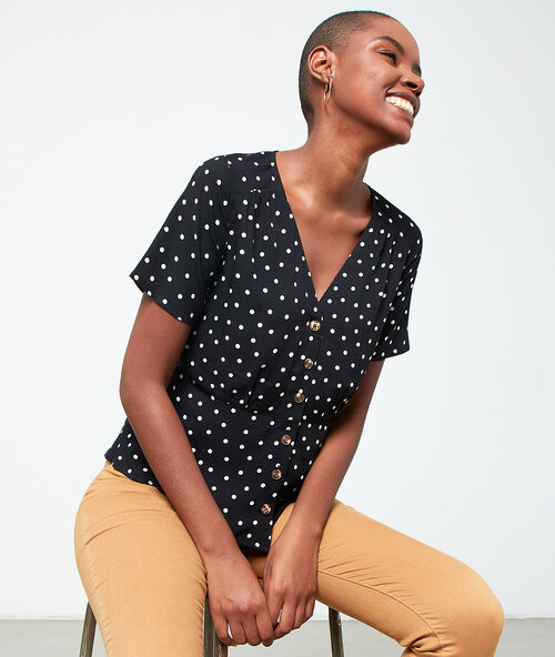Blouse met knopenrij en polkadots zwart.